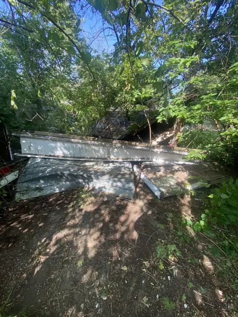 Fallen tree removed from a fence line