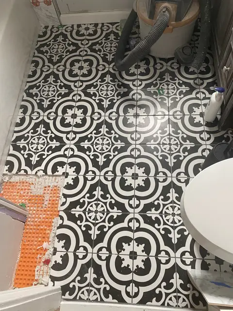 Patterned tile bathroom floor