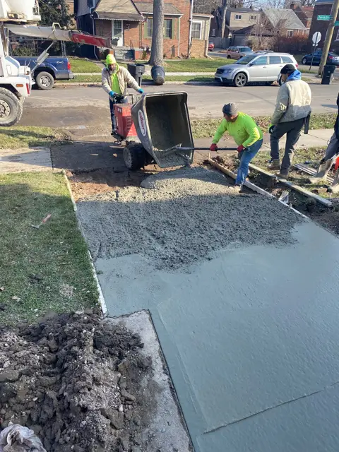 Crew pouring a sidewalk