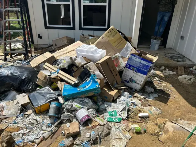Hoarded yard trash, before cleanout