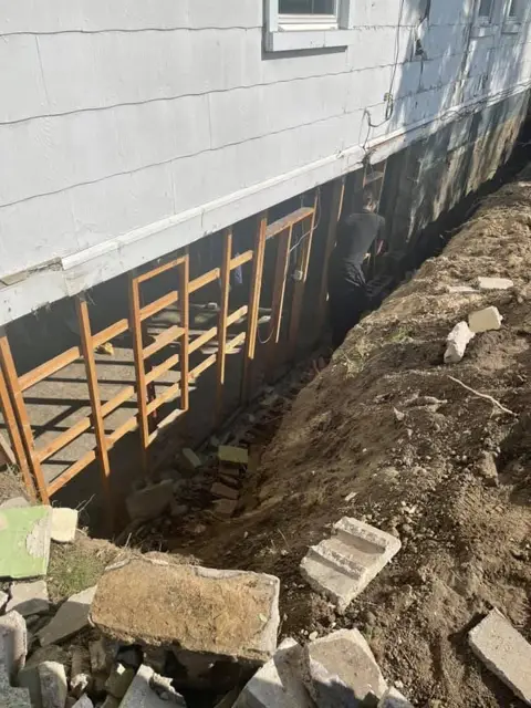 Foundation dug out for repair
