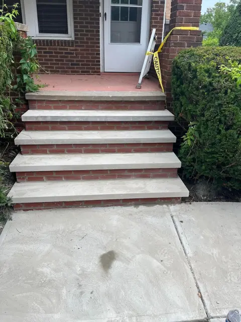 Porch steps rebuilt in brick and concrete
