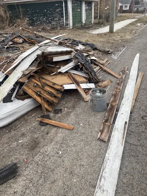 Demo debris staged for haul-off