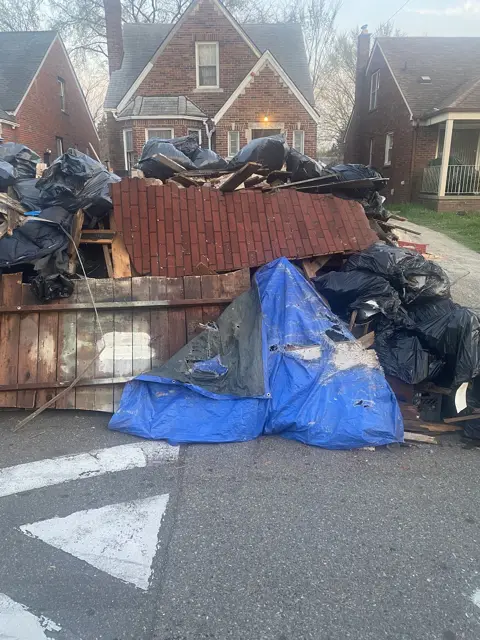 Fence and bagged debris haul-off
