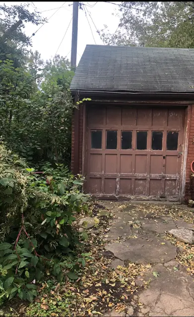Before: garage and yard ahead of demo